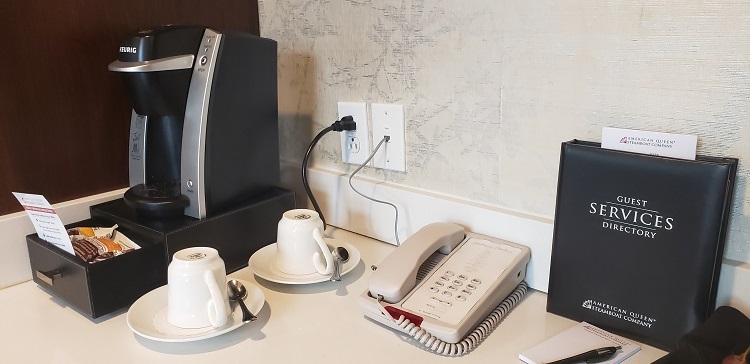 A Keurig coffeemaker, telephone and guest services menu are located on the entertainment/bar area counter. Photo by Susan J. Young