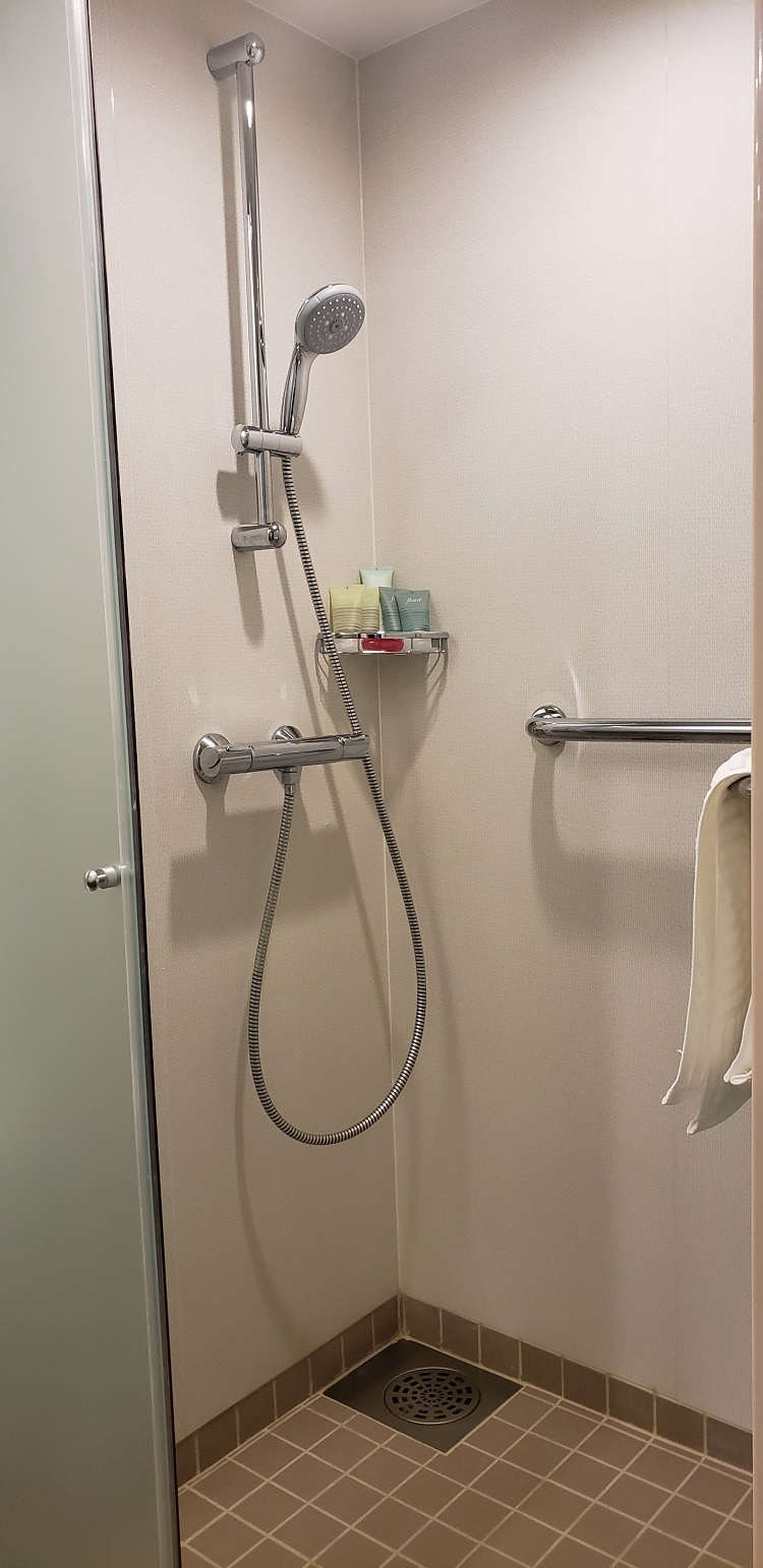 A walk-in shower is located within the first level guest bathroom. Photo by Susan J. Young
