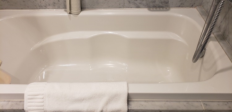 The large soaking tub/combination shower inside the master bathroom of a two-level Loft Suite. Photo by Susan J. Young