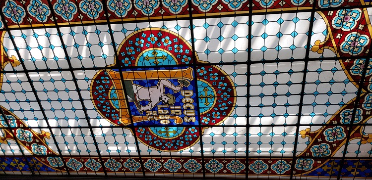 Stained glass ceiling at Levraria Lello, a bookshop in Porto, Portugal. Photo by Susan J. Young