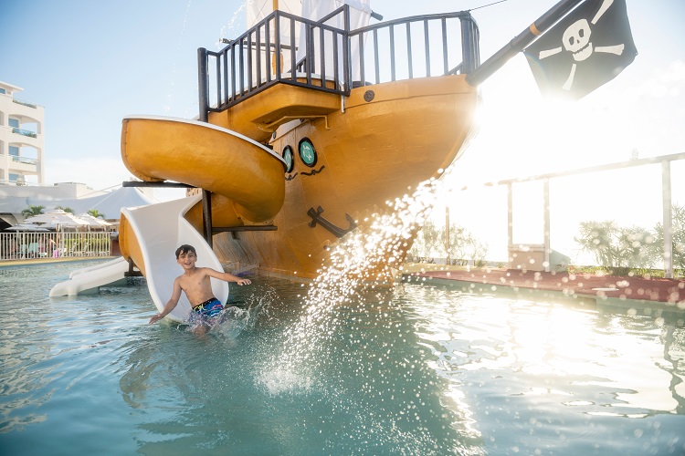The Wyndham Alltra Cancun's family-focused, pirate-themed water park is shown above. Photo by Playa Hotels & Resorts.
