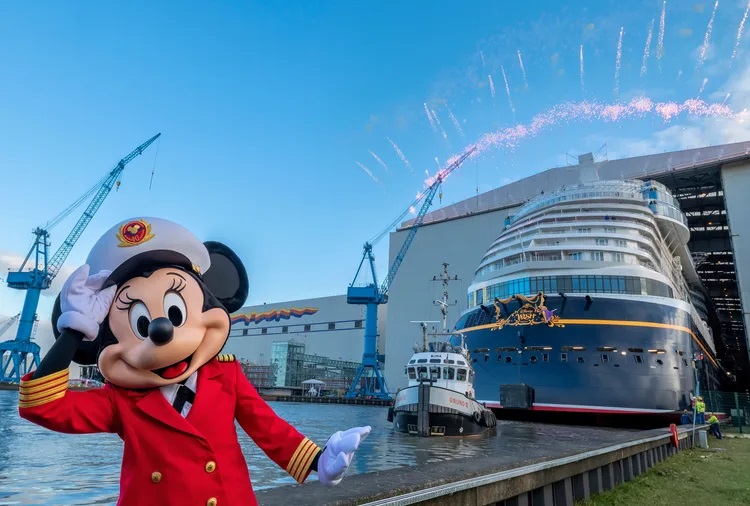 he Disney Wish hit water for the first time today when it floated out of an enclosed building dock at the Meyer Werft shipyard in Papenburg, Germany. The major construction milestone commenced in true Disney style with fireworks and a special appearance by Captain Minnie Mouse. When it sets sail this summer, the newest Disney Cruise Line ship will be filled with innovative new experiences steeped in Disney storytelling, including the first-ever Disney attraction at sea, immersive dining experiences themed to “Frozen” and Marvel, and a high-end lounge set in the Star Wars galaxy. (Robert Fiebak, photographer)