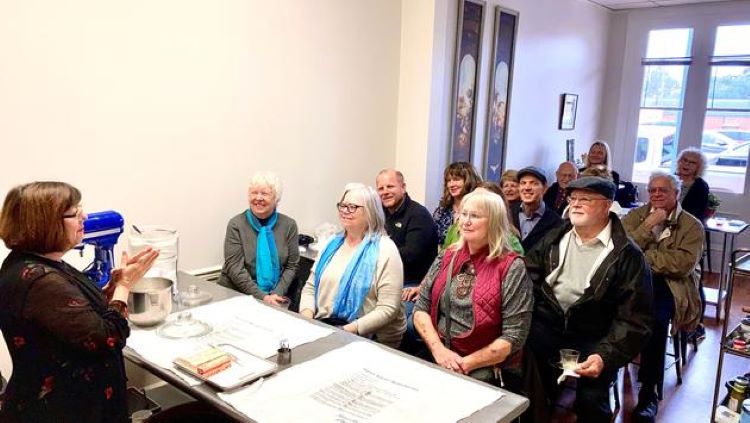 Regina Charboneau hosts travel advisors for a cooking class in Natchez, MS. Photo by American Queen Voyages. 