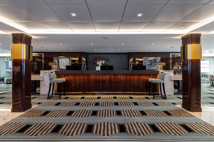 Reception/purser's desk area on World Navigator. Photo by Atlas Ocean Voyages.