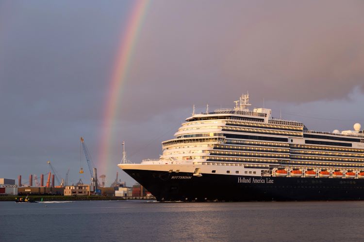 Holland America's new flagship, Rotterdam, is shown under a rainbow at the Port of Rotterdam, The Netherlands. Photo by Holland America LIne.
