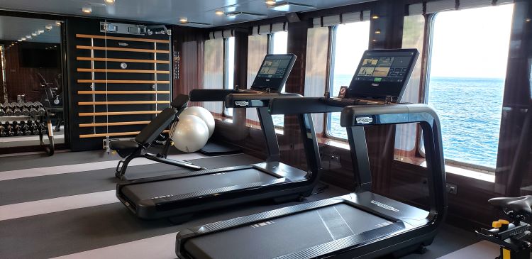 Staying fit on a cruise is easy with the cruise lines' onboard fitness centers. Shown above is the fitness facility of the new Atlas Ocean Cruises' World Navigator. Photo by Susan J. Young