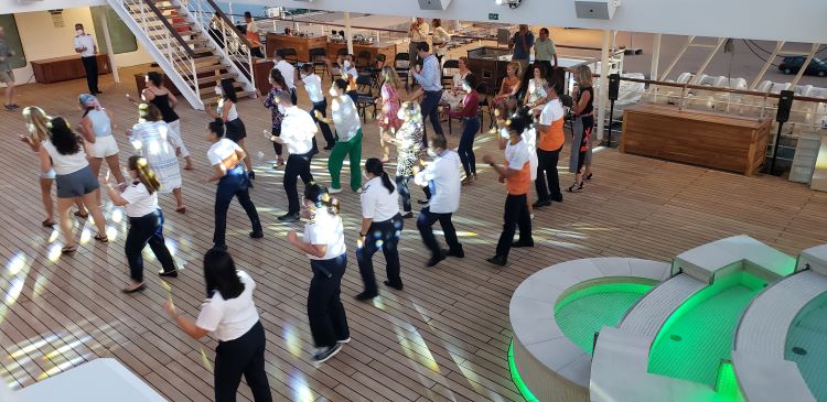 Line dancing by guests and crew on the newly enlarged Pool Deck of Star Pride. Photo by Susan J. Young.