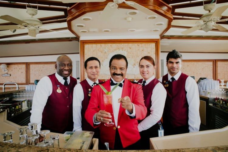 Ted Lange played Isaac, the bartender, on the original "Love Boat" TV series. Here he takes a turn at concocting a cocktail,backedup by Princess' bartending crew. Photo by Princess Cruises.