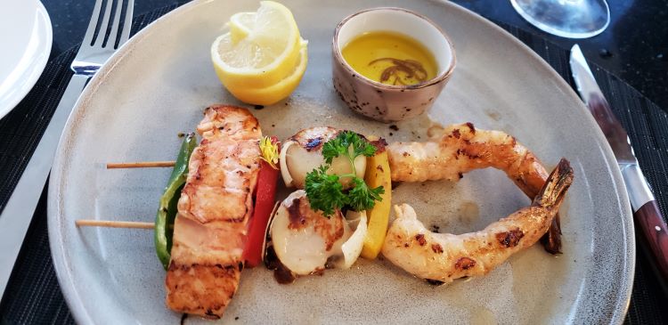 Fresh seafood skewers for dinner at Candles on the exterior forward deck of Star Pride. Photo by Susan J. Young.