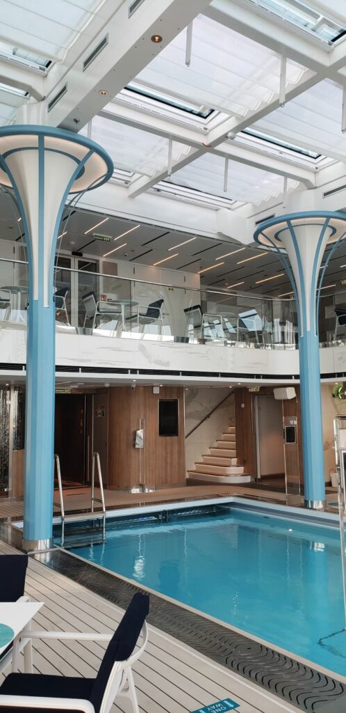 The two-story solarium and interior pool of Crystal Endeavor, soon to sail as Silver Endeavour. Photo by Susan J. Young.