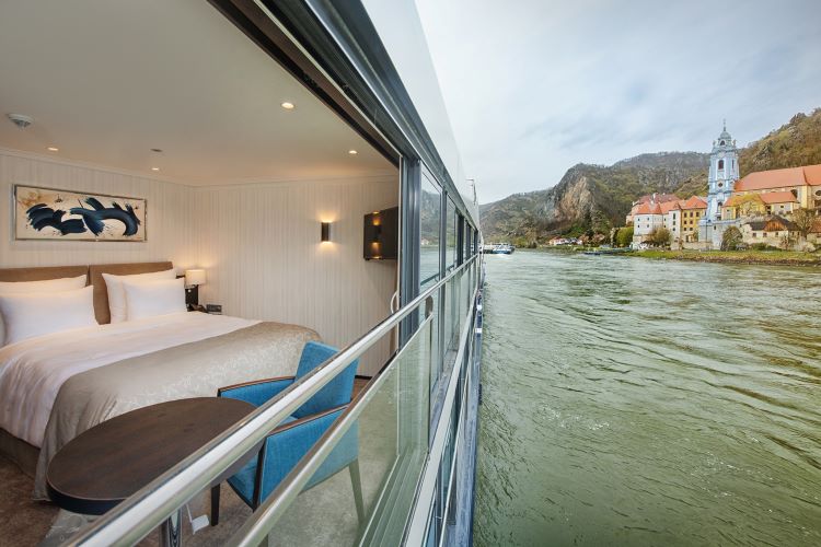 Panorama Suites on Avalon Waterways river vessels face "the view" with a wall of glass that converts to an open-air balcony. Photo by Avalon Waterways.