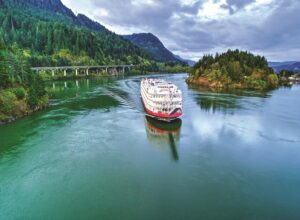 American Empress is among the small ships sailing the Columbia and Snake rivers of the Pacific Northwest. It's shown here near The Dalles. Photo by American Queen Voyages.