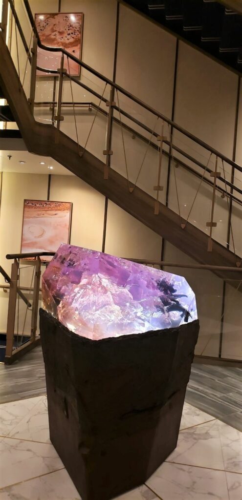 Artwork at the base of the Atrium staircase on Seabourn Venture. Photo by Susan J. Young.