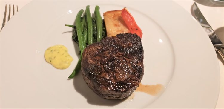 Steak entree in the main Restaurant of Seabourn Venture. Photo by Susan J. Young. 