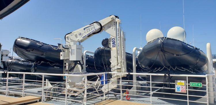 Zodiacs on Seabourn Venture's top deck and a crain for lowering them to the ocean. Photo by Susan J. Young.