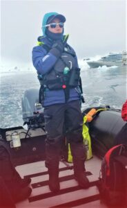 A Zodiak expedition guide heads out with a boat of guests from Silver Endeavour in Antarctica. Photo by Susan J. Young.