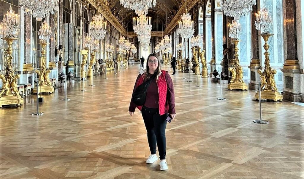 Lee Alvarez, a professional travel advisor from Pavlus Travel, is shown at Versailles, France. Photo provided by Lee Alvarez.