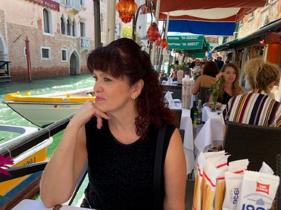 Pam Chavez, a Pavlus Travel vacation travel planner, enjoys travel to Italy; she's shown here in Venice. Photo by Pam Chavez.