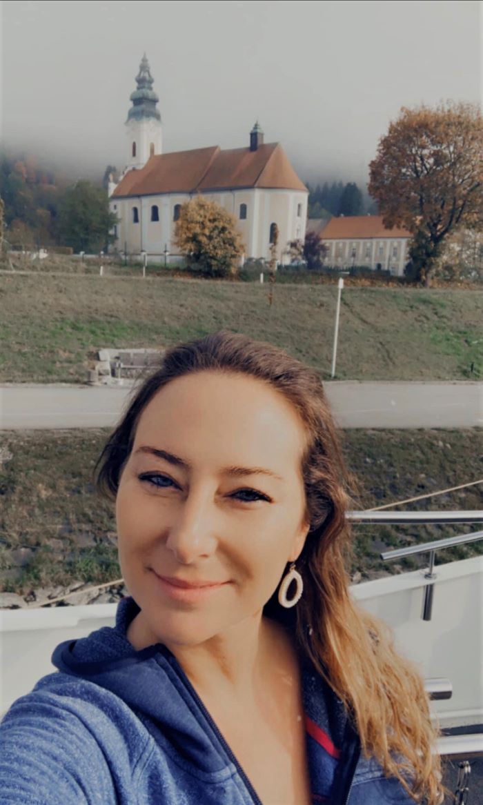 Jamie Roach, a Pavlus Travel personal travel planner is shown above at Engelhartszell, Austria on a Tauck river cruise in 2022.