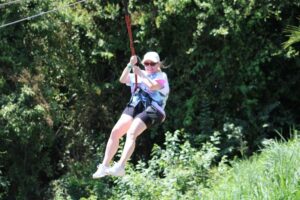 Personal travel planner Shari Bazzoni goes zip lining on a recent Caribbean cruise vacation.