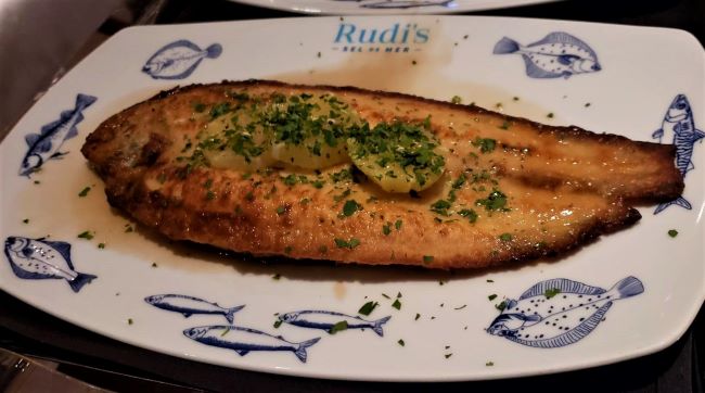 Whole Dover Sole Meuniere" with butter and parsley. This is a dish served at Rudi's Sel de Mer. Photo by Susan J. Young.