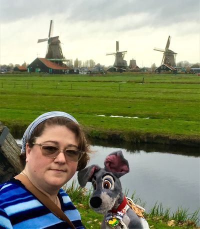 Mandy Mac Mullin, a Pavlus Travel personal travel planner, has traveled widely across the globe. She's shown her with the windmills of The Netherlands. Photo courtesy of Mandy Mac Mullin.