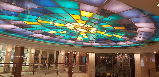 The atrium of Crystal Serenity has been retained, even on the refreshed ship. So guests who have sailed on the ship in the past will find a familiar, iconic touch. Photo by Susan J. Young.