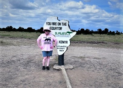 Pavlus Travel's Fia Bauer is shown about to "straddle" the Equator line, and walk it as well -- not an easy effort given gravitational pulls from either side. Photo by Fia Bauer.