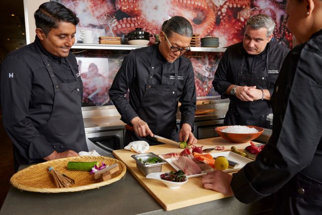 Holland America chefs learn techniques and fresh seafood recipes from Chef Chef Masaharu Morimoto, the line's fresh fish ambassador. Photo by Holland America Line.