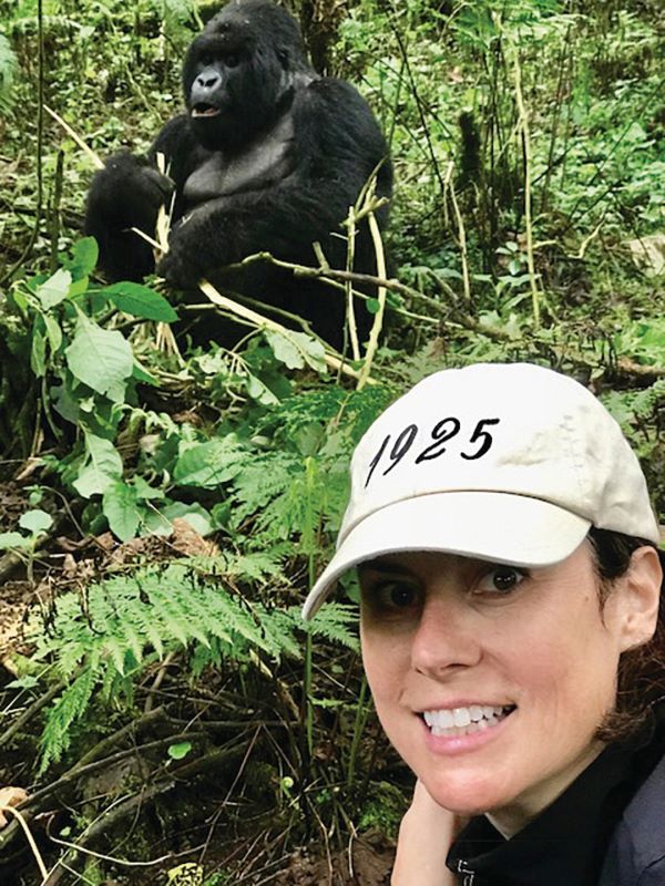 Kelly Rossiter, senior product manager, Africa and South America, for Tauck. She's shown with a gorilla in Rwanda. Photo by Tauck.