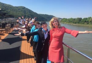 Kristin Karst and crew members atop one of AmaWaterways river vessels in Europe. Photo by AmaWaterways.
