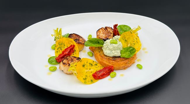 A new dish at Solis is roasted scallops with toasted brioche, spinach, ricotta, broad beans and crisp, yellow beet roots. Photo by Seabourn.