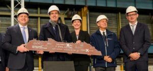 Jason Liberty, CEO, Carnival Corporation, and other cruise company and Chantiers d'Atlantique shipyard officials celebrate the first steel cut for the fifth Edge Series ship, Celebrity Xcel.