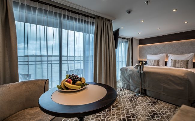 In the latest travel news announcement, Riviera River Cruises said that its guests can indulge their personal passion (art, history, cuisine, music and more) on new themed cruises. The Geoffrey Chaucer's deluxe balcony suite is shown above. Photo by Riviera River Cruises. 