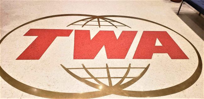 TWA floor logo at the TWA Hotel at JFK Airport; that's located in the former TWA terminal there. Photo by Susan J. Young. 