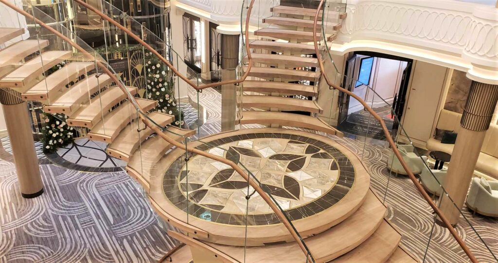 The dramatic staircase of Seven Seas Grandeur's Grand Atrium. Photo by Susan J. Young. 