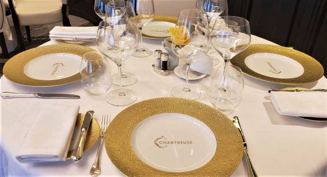 The elegant table settings with charger plates at Chartreuse on Seven Seas Grandeur. Photo by Susan J. Young. 