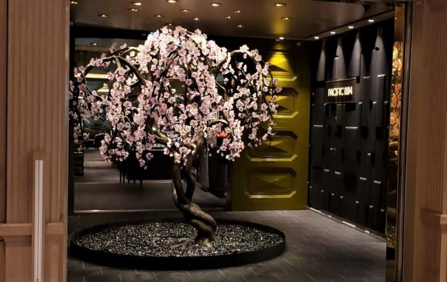 Pacific Rim specialty dining venue on Regent Seven Seas Cruises new Seven Seas Grandeur. Cherry blossom tree art piece at the restaurant's entrance is shown above. Photo by Susan J. Young. 