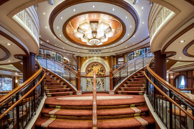 The gorgeous grand staircase of Queen Elizabeth. Photo by MacKintosh Photo, courtesy of Cunard Line.