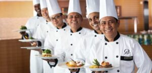 What's new for tasty culinary cruises? Paul Gauguin has guest culinary expert sailing this year, along with regular shipboard chefs, shown above. Photo by Paul Gauguin Cruises.