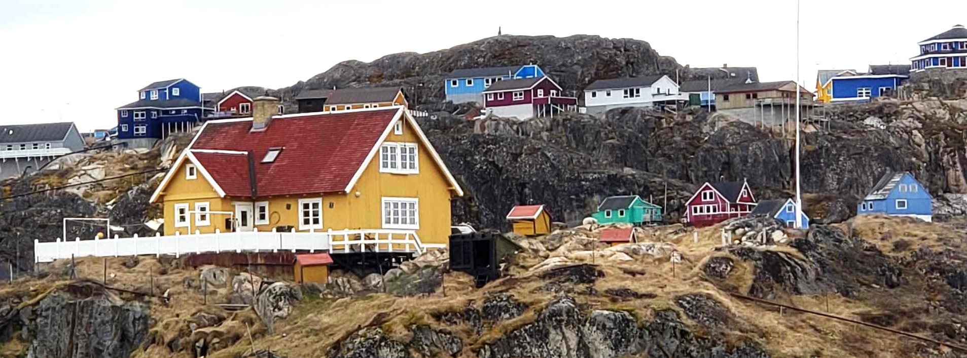 Small colorful houses dot the landscape at Sisimuit, Greenland. Photo by Susan J. Young. 