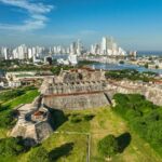 Modern Cartagena, Colombia is shown in the backgroun, and the Spanish-era fortress in the foreground. Photo by PROCOLOMBIA.