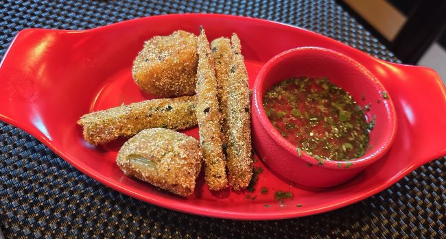 Fried green tomatoes and okra were among the starter options at Razzle Dazzle aboard Virgin Voyages' Scarlet Lady. Photo by Susan J. Young.