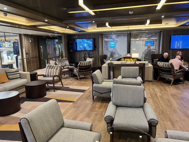 The Expedition Lounge of Seabourn Venture is a cozy spot for enjoying a drink prior to a briefing in the Discovery Center. Photo by Erin Conner. 