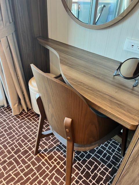 In a Seabourn Venture Veranda Suite, a makeup vanity can double as a remote work space. Photo by Erin Conner.