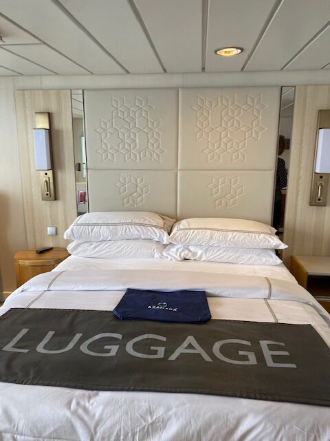 Bed in Leann Wright's Veranda stateroom on Azamara Quest. Photo by Leann Wright.