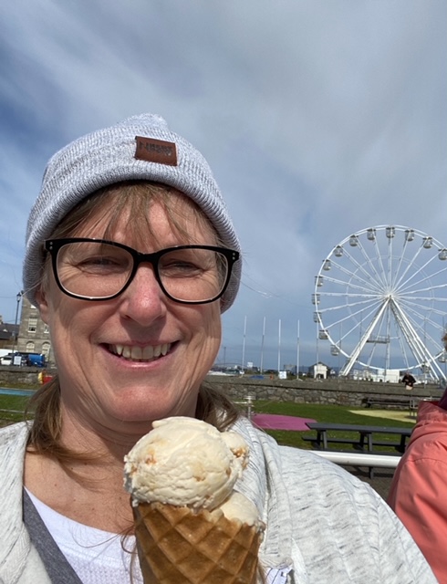 Photo of Dianne Kincaid enjoying an ice cream and theme park. Photo by Dianne Kincaid. 