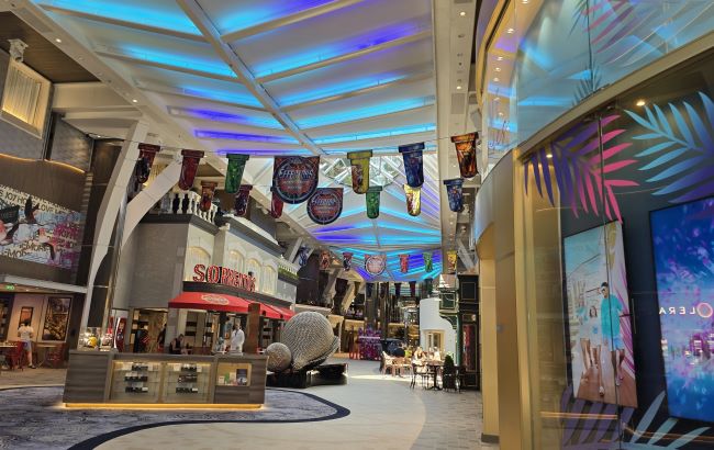 Sorrento, Royal Caribbean International's pizza eatery, is within the Grand Promenade on Utopia of the Seas. It's a great spot for having a yummy slice of pizza or two and doing "people watching." Photo by Susan J. Young. 