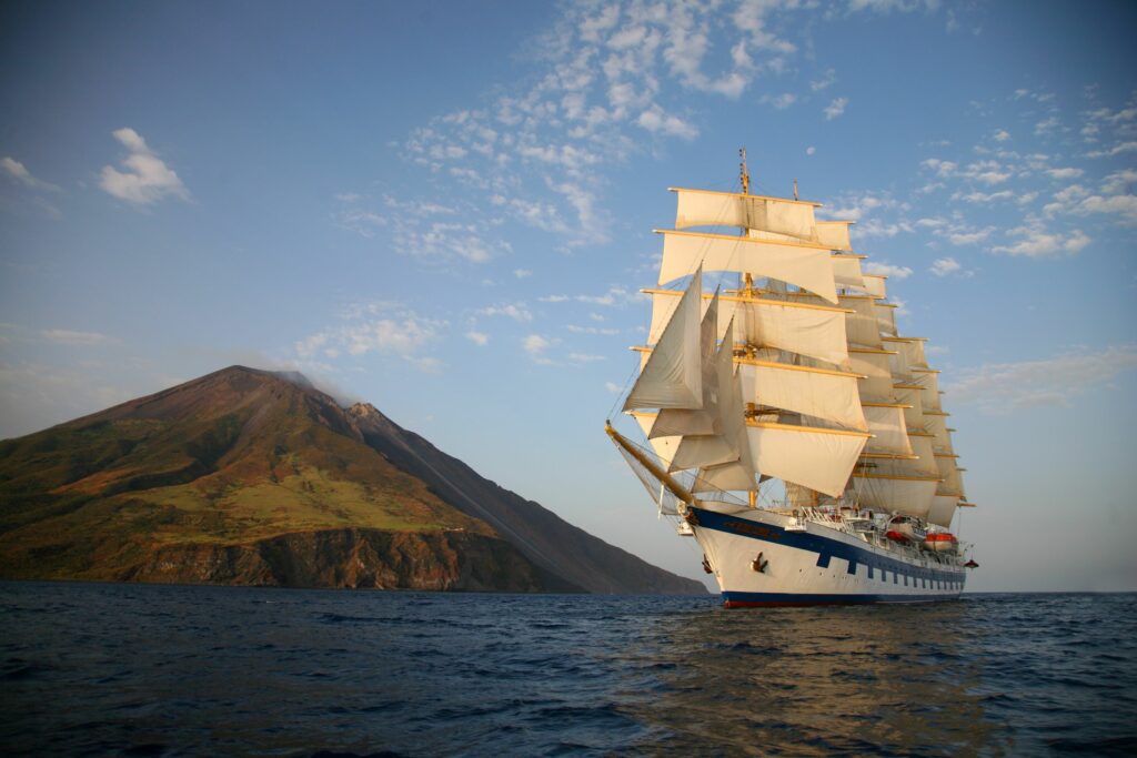 Royal Clipper sails near the island of Stromboli in the Mediterranean Sea. Photo by Star Clippers. 