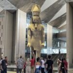 Greeting visitors to the new Grand Egyptian Museum is a huge ancient statue of Ramses II. Photo by Susan J. Young.